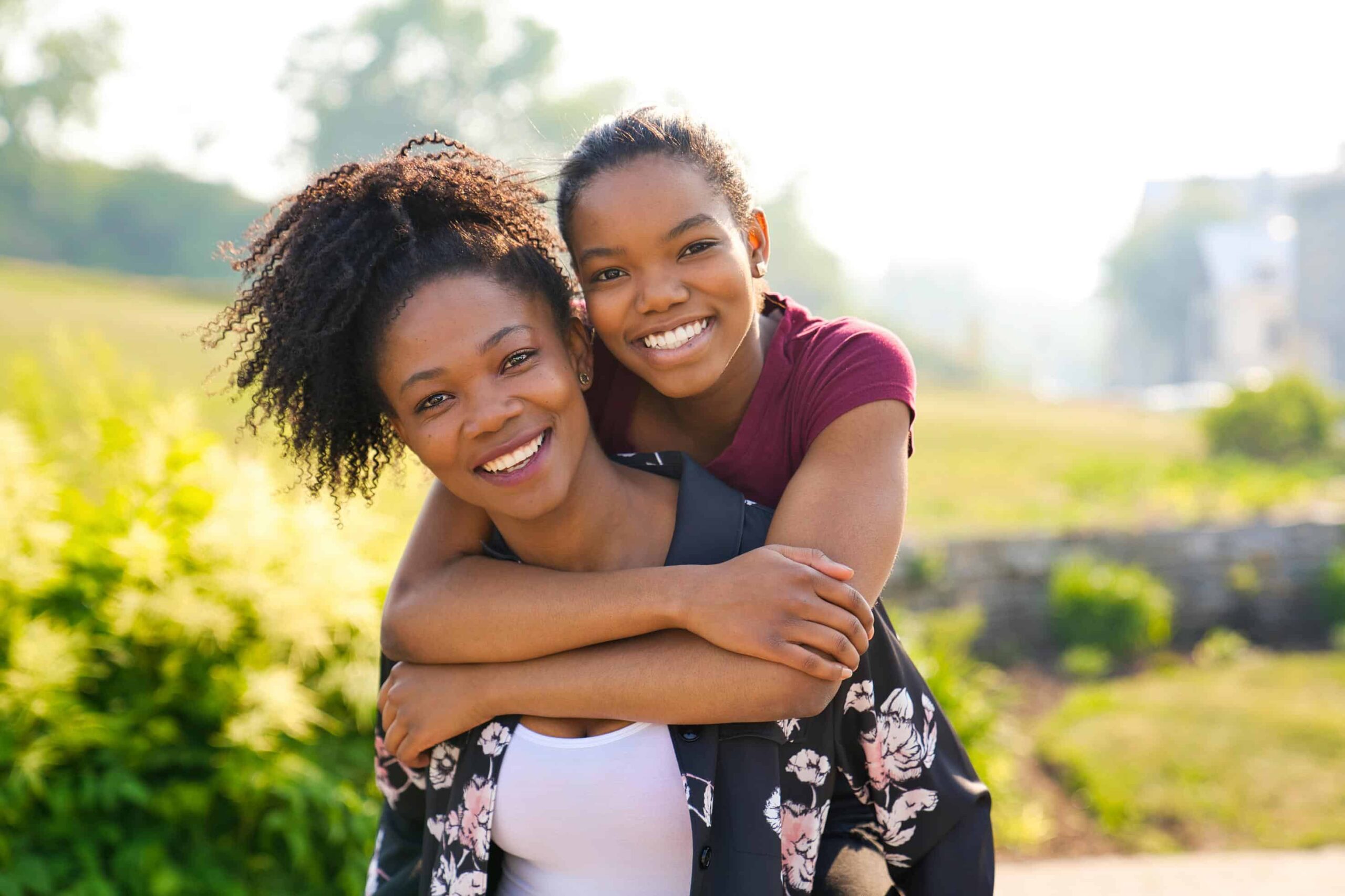 Mother-and-daughter-piggyback-your-first-visit-at-eberle-orthodontics Your first visit