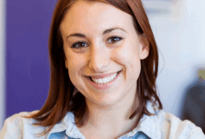 How to stay on track with invisalign treatment 6 Young woman smiling confidently after invisalign® treatment at eberle orthodontics