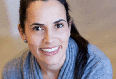 Braces or aligners? How to choose the best option 6 Woman with dark hair in sweater